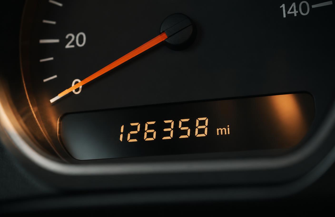 Close-up of a car instrument cluster showing the odometer mileage reading
